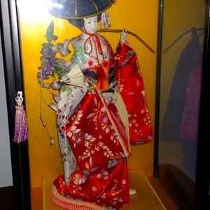 Vintage Japanese geisha girl with display case.  By Kawasaki Designer.